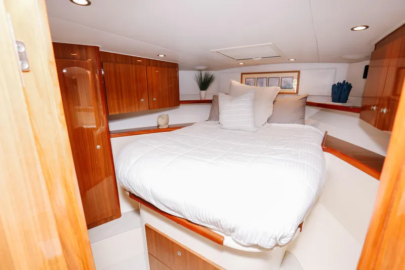 Slide: The Image of Luxurious bedroom interior of 2013 Viking 42 Convertible yacht with elegant wood finishes. - 9