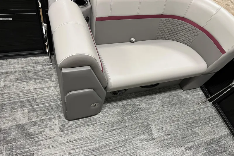 Slide: The Image of 2024 Qwest 8520 Lanai (XG02) boat interior with gray seating and textured flooring. - 5