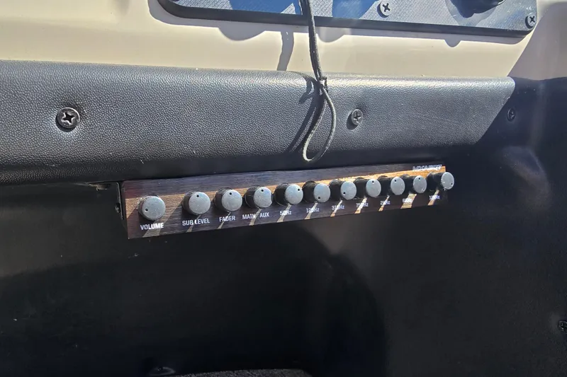 Slide: The Image of Audio control panel in a 2020 Barletta C24QC boat, featuring volume and equalizer knobs. - 12