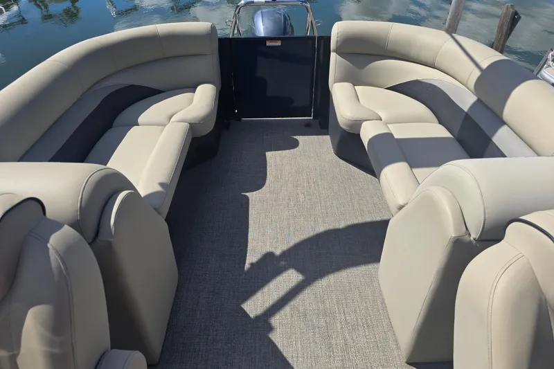 Slide: The Image of 2020 Barletta C24QC pontoon boat interior with beige seating and carpeted floor. - 16