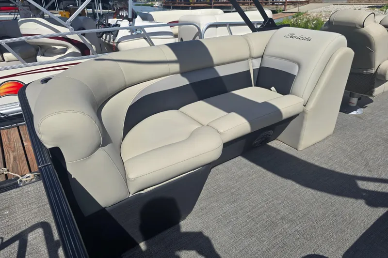 Slide: The Image of 2020 Barletta C24QC pontoon boat with beige seating and elegant design. - 18