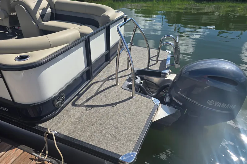 Slide: The Image of 2020 Barletta C24QC pontoon boat with Yamaha outboard motor on a sunny day. - 21