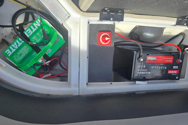 Slide: The Image of 2020 Barletta C24QC boat battery compartment with Interstate and Shuriken batteries. - 23