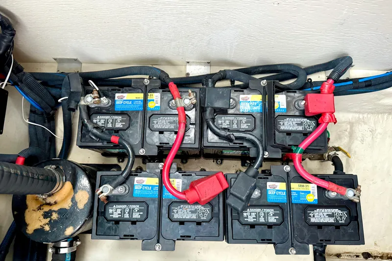 Slide: The Image of Battery compartment of a 2006 Sea Ray 320 Sundancer with deep cycle batteries and wiring. - 30