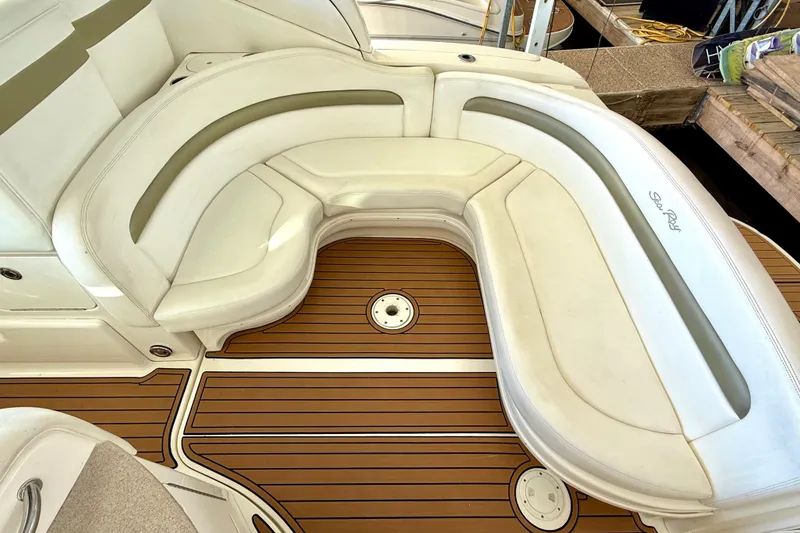 Slide: The Image of Luxury seating on 2006 Sea Ray 320 Sundancer boat with teak flooring. - 38