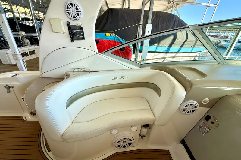 Slide: The Image of 2006 Sea Ray 320 Sundancer interior with white seating and speaker system. - 40
