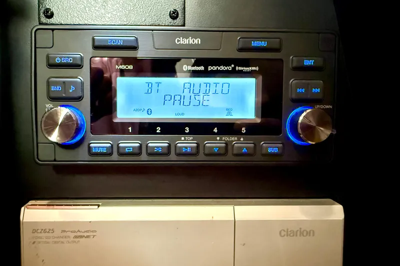 Slide: The Image of Clarion audio system in 2006 Sea Ray 320 Sundancer, displaying "BT Audio Pause." - 49