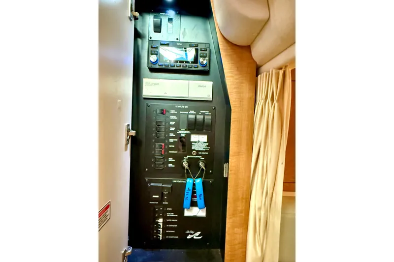 Slide: The Image of Electrical control panel inside 2006 Sea Ray 320 Sundancer boat cabin. - 50
