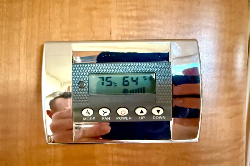 Slide: The Image of Thermostat control panel on 2006 Sea Ray 320 Sundancer boat interior. - 56