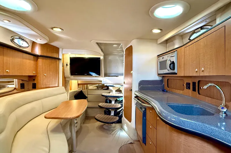 Slide: The Image of Luxurious interior of 2006 Sea Ray 320 Sundancer yacht with modern amenities and elegant design. - 57
