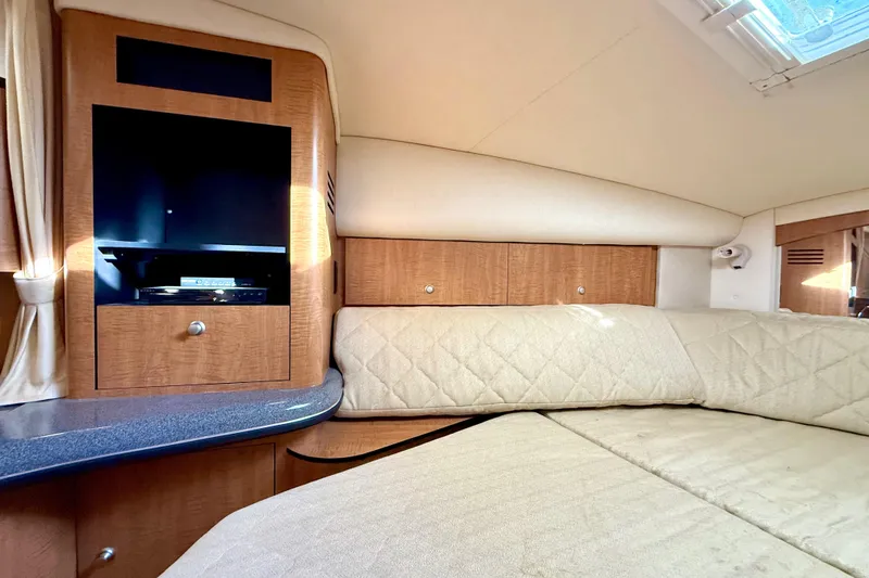Slide: The Image of Interior of 2006 Sea Ray 320 Sundancer with cozy seating and entertainment area. - 60