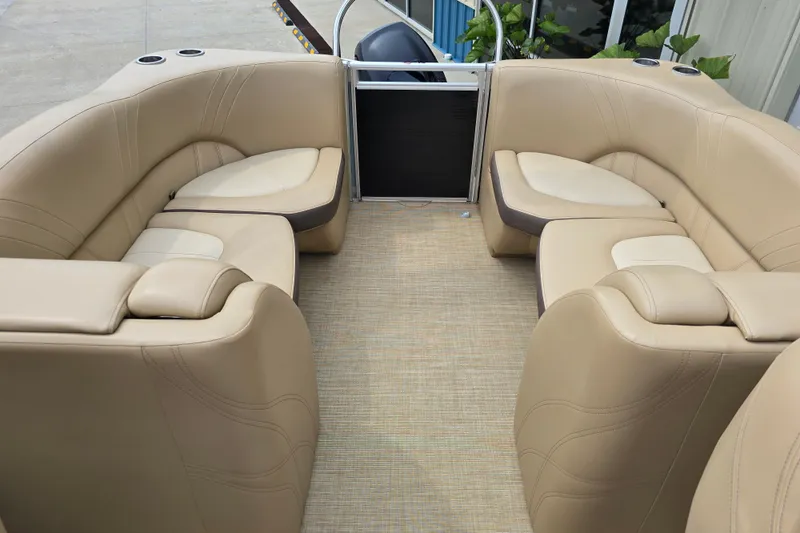 Slide: The Image of 2017 Harris Solstice 240 boat interior with beige seating and cup holders. - 24