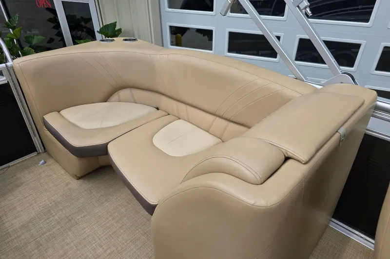 Slide: The Image of 2017 Harris Solstice 240 boat interior with beige leather seating and modern design. - 26