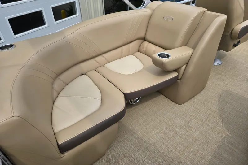 Slide: The Image of Luxurious beige seating on 2017 Harris Solstice 240 boat, featuring cup holder and elegant design. - 27