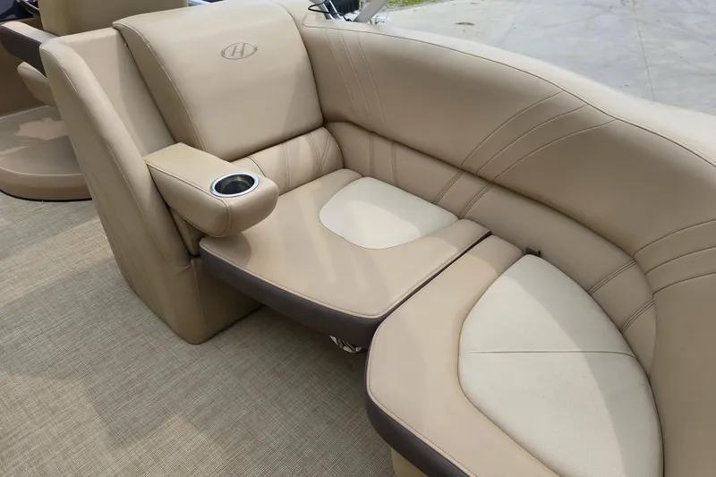 Slide: The Image of Luxurious beige seating on 2017 Harris Solstice 240 boat with cup holder. - 28