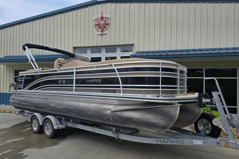 Slide: The Image of 2017 Harris Solstice 240 pontoon boat on trailer outside Lake Viking Marine. - 3