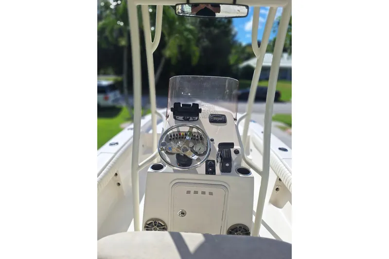 Slide: The Image of 2018 Sea Chaser 21 LX boat console with steering wheel and controls. - 3