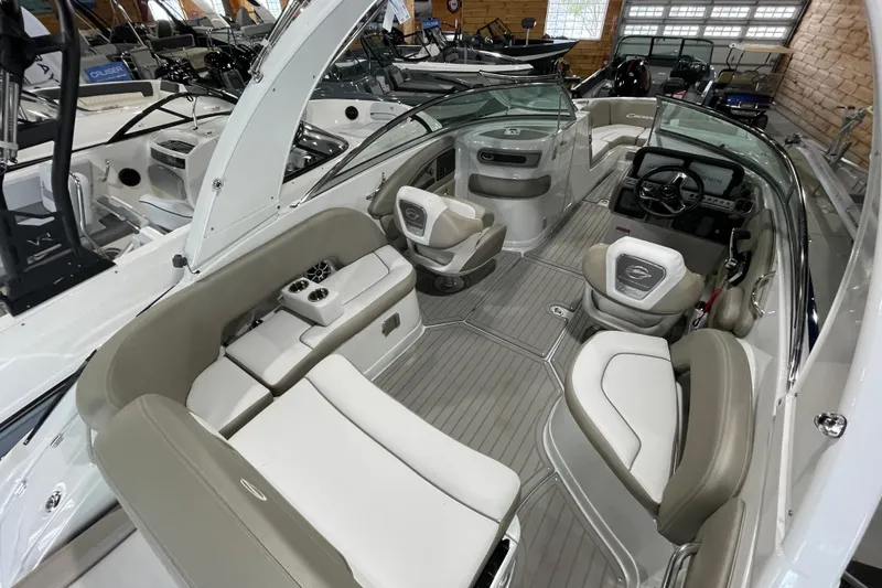 Slide: The Image of 2026 Crownline 260 SS boat interior with luxurious seating and modern dashboard. - 17