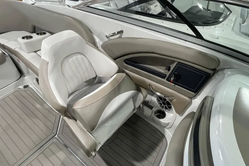 Slide: The Image of Interior of 2026 Crownline 260 SS boat, featuring luxurious seating and modern dashboard. - 20