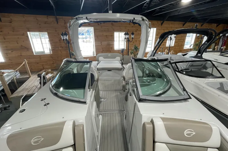 Slide: The Image of 2026 Crownline 260 SS boat interior with sleek design and modern features in showroom. - 23