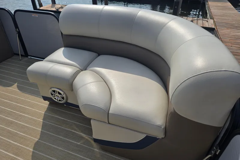 Slide: The Image of Luxurious seating on 2019 Manitou 21 Oasis RF pontoon boat, featuring plush upholstery. - 12