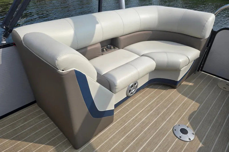 Slide: The Image of Luxurious seating on 2019 Manitou 21 Oasis RF pontoon boat, featuring plush upholstery. - 14
