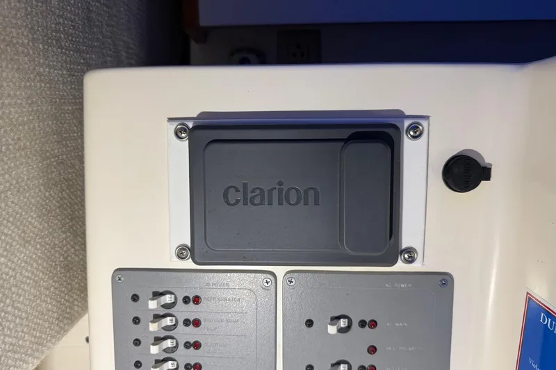 Slide: The Image of Control panel of a 1998 Pursuit 2860 Denali boat with Clarion cover. - 42