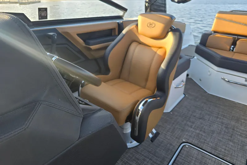 Slide: The Image of 2022 Cobalt R4 Surf boat interior with luxurious tan seating and sleek design. - 18