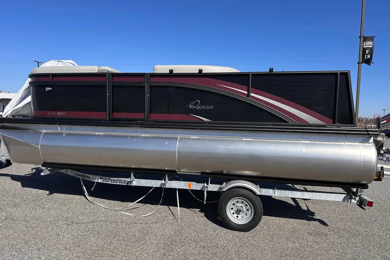 The Image of 2025 Qwest 18 XRE Cruise pontoon boat on trailer, side view. - 0