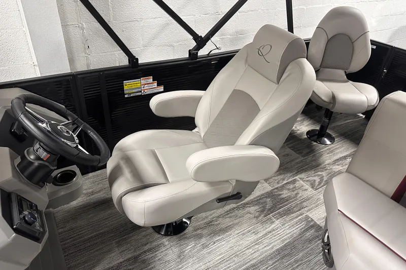 Slide: The Image of Luxurious interior of 2025 Qwest 18 XRE Cruise boat with plush seating and modern steering. - 6