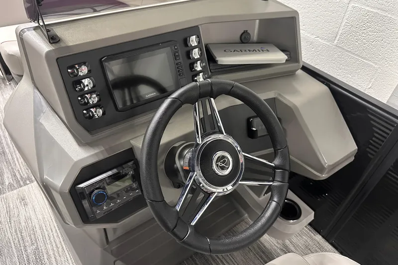 Slide: The Image of Steering console of 2025 Qwest 18 XRE Cruise boat with Garmin navigation system. - 7