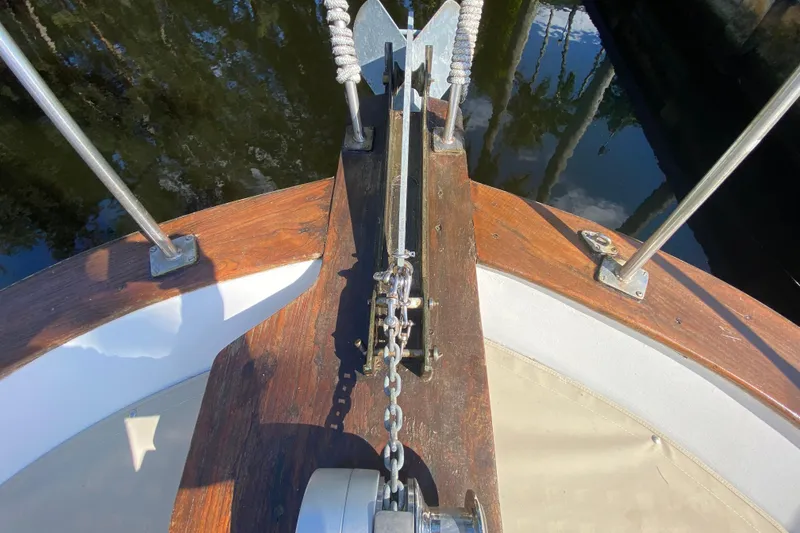 Slide: The Image of Bow of a 1974 CHB 34 boat with anchor chain and wooden deck. - 18
