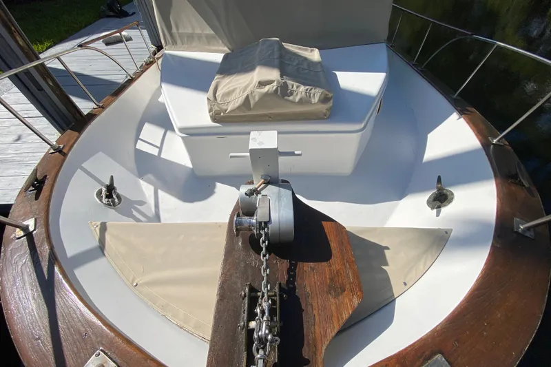 Slide: The Image of 1974 CHB 34 boat deck with anchor chain and seating area. - 20