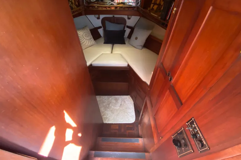 Slide: The Image of Interior of a 1974 CHB 34 boat with cozy cabin and wooden finish. - 31