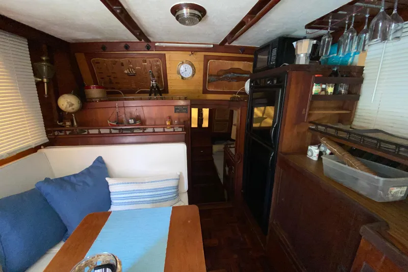 Slide: The Image of Interior of a 1974 CHB 34 boat with cozy seating and nautical decor. - 41