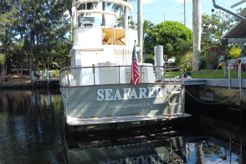 Slide: The Image of 1974 CHB 34 boat "Seafarer" docked in Fort Lauderdale, Florida, with American flag. - 57