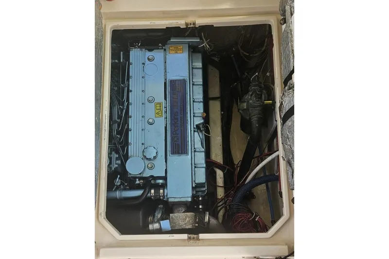 Slide: The Image of Engine compartment of a 2004 Albin 30 Family Cruiser, featuring a Perkins engine. - 18