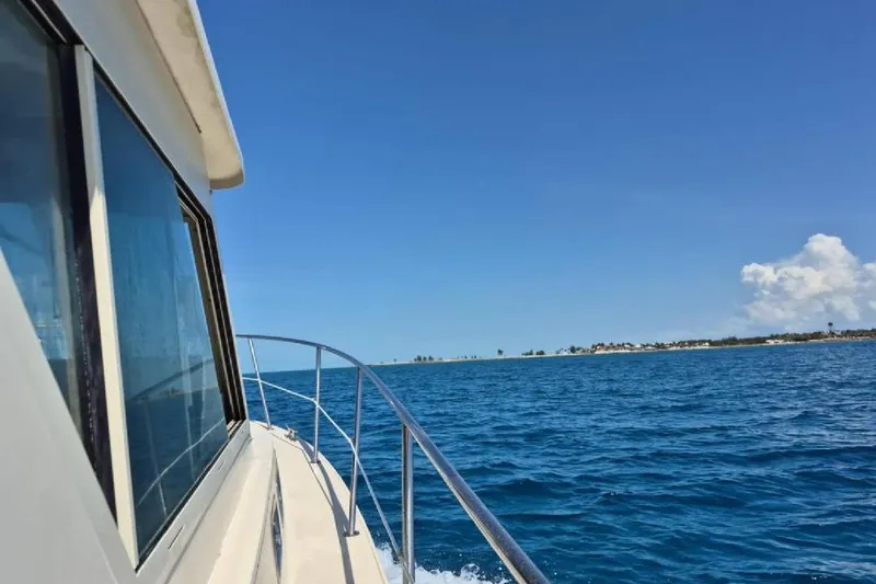 Slide: The Image of 2004 Albin 30 Family Cruiser sailing on clear blue ocean under sunny sky. - 5