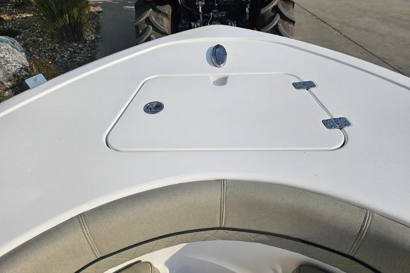 Slide: The Image of 2023 Sportsman Open 212 Center Console boat bow with storage compartment. - 15
