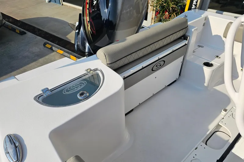Slide: The Image of 2023 Sportsman Open 212 Center Console boat interior with seating and storage. - 7