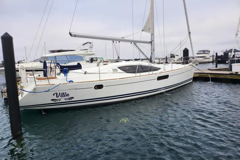 The Image of 2010 Jeanneau Sun Odyssey 45 DS sailboat docked in a marina. - 1