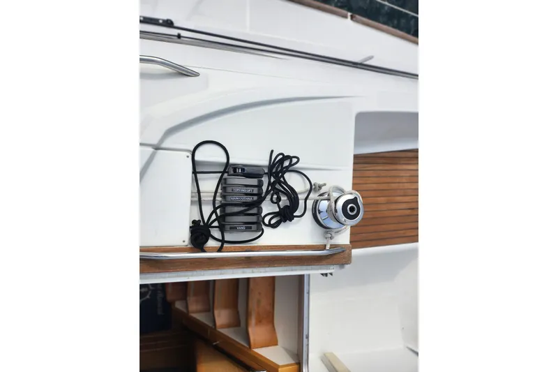 Slide: The Image of Jeanneau Sun Odyssey 45 DS 2010 sailboat deck with winch and rope details. - 14