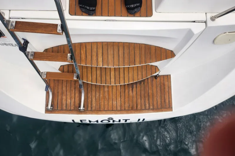 Slide: The Image of Teak swim platform and ladder on 2010 Jeanneau Sun Odyssey 45 DS yacht. - 18