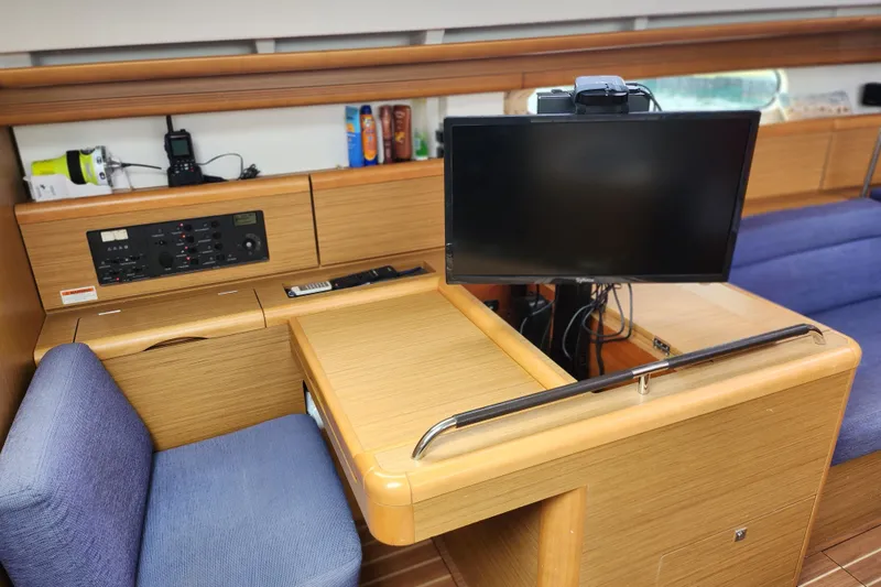 Slide: The Image of Interior of 2010 Jeanneau Sun Odyssey 45 DS yacht with navigation station and monitor. - 23