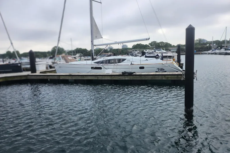 Slide: The Image of 2010 Jeanneau Sun Odyssey 45 DS sailboat docked in a marina. - 3