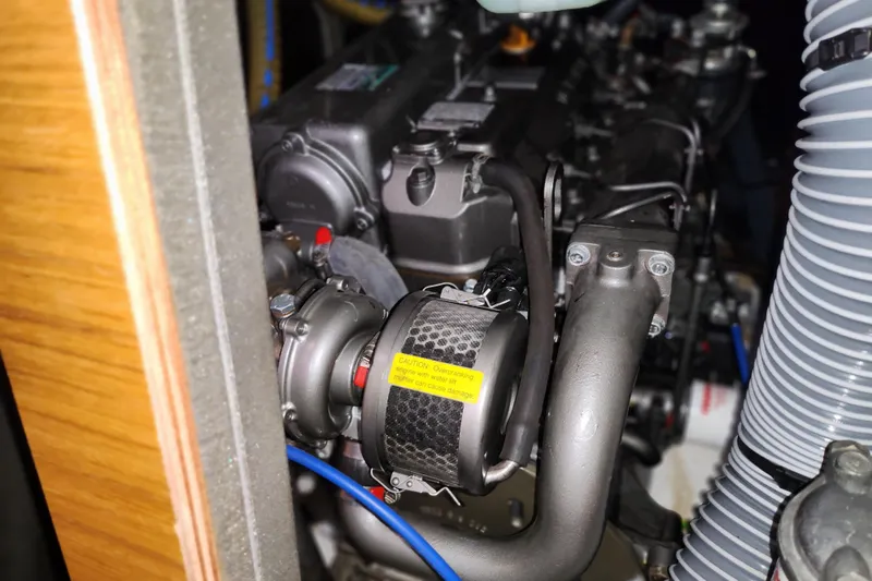 Slide: The Image of Engine compartment of 2010 Jeanneau Sun Odyssey 45 DS sailboat, showcasing mechanical components. - 35