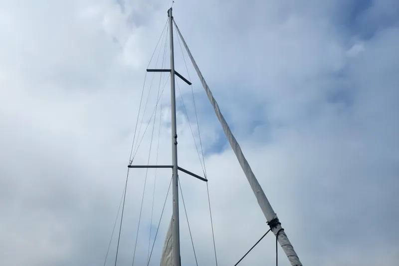 Slide: The Image of Mast of 2010 Jeanneau Sun Odyssey 45 DS sailboat against cloudy sky. - 4