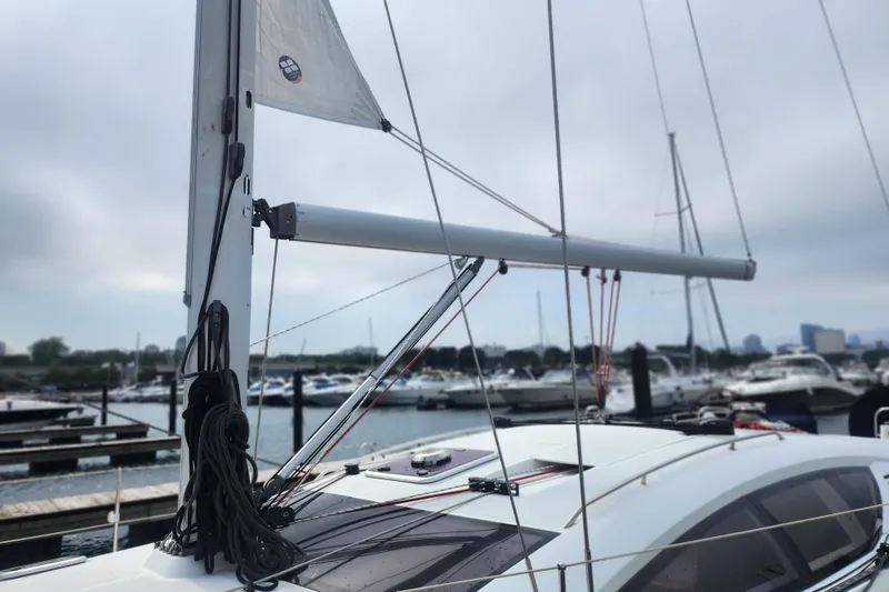 Slide: The Image of 2010 Jeanneau Sun Odyssey 45 DS sailboat docked at marina, mast and rigging visible. - 5