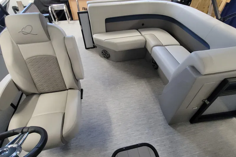 Slide: The Image of Luxurious interior of 2025 Qwest 22 Lanai E-Class TriToon boat with plush seating. - 4