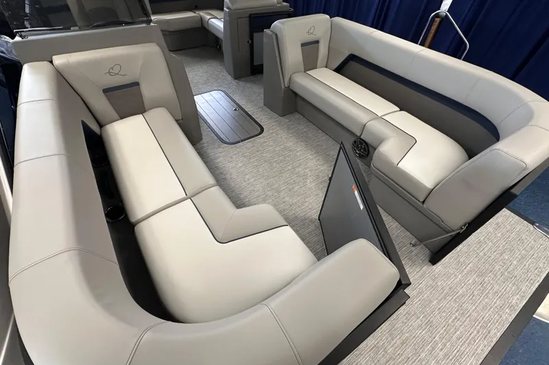 Slide: The Image of 2025 Qwest 22 Lanai E-Class TriToon interior with luxurious seating and modern design. - 7